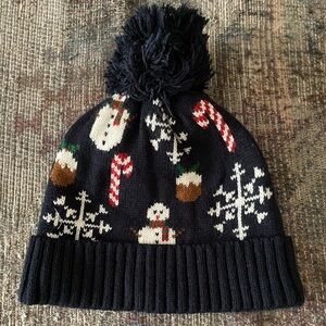 Black snowman pom-pom beanie.
